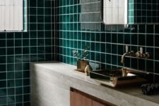 10 glossy dark green tiles, stone, marble tiles and wood create a fantastic combo for a stylish bathroom look