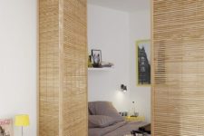 10 wood lattice doors gently separate the sleeping zone from the rest of the open layout letting light in