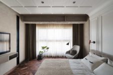 12 The master bedroom is a very cozy and neutral space with upholstered furniture