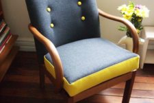 12 a grey chair with yellow buttons and framing of the seat for a bold and fresh look