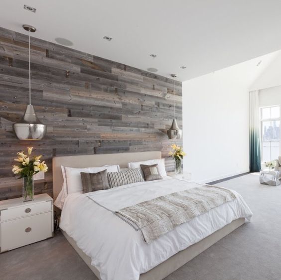 a reclaimed wood accent wall to add a cozy rustic touch to the bedroom