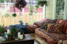 13 a boho gypsy porch with a wooden chest as a side table, a whole hanging garden and a corner sofa with printed upholstery
