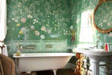 13 green floral wallpaper covering the walls creates a chic and stylish look with a vintage feel