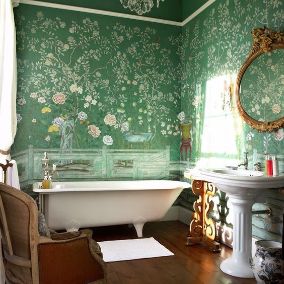 green floral wallpaper covering the walls creates a chic and stylish look with a vintage feel