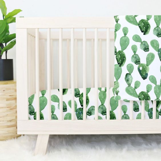 make your nursery sweeter and boho-like with fun watercolor cactus print bedding like this