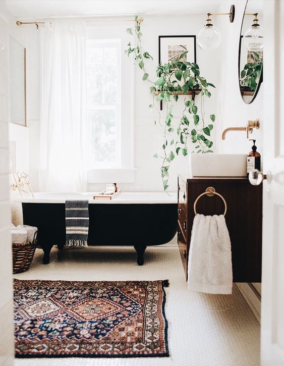 make your space boho with potted plants, a printed rug and some baskets