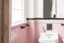 13 pink tiles with a black tile trim create a glam and girlish space and a white part makes it brighter