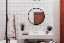 14 a boho space with white tiles, a jute rug, wooden items and baskets and a white concrete vanity