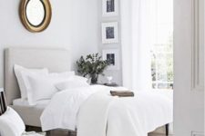 14 an airy and neutral space with sheer curtains, crispy white bedding and some darker touches for depth