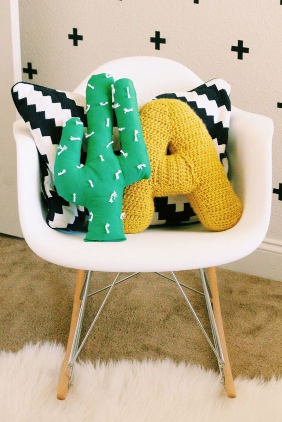 a bold green cactus pillow is a simple way to spruce up the space and you can DIY it