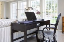 15 a vintage black desk and chair differ in style and stand out from a rustic space, it helps to visually separate the spaces