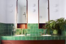 15 glossy green tiles with a texture and rich wood plus potted greenery for a luxurious and relaxing space