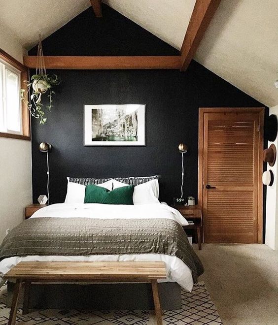 sometimes a painted black wall is what brings comfort and relaxation to your bedroom