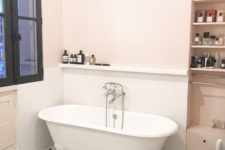15 very light pink walls and a mosaic tile floor create a refined and modern look