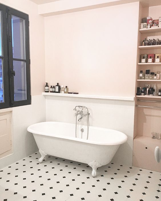 very light pink walls and a mosaic tile floor create a refined and modern look