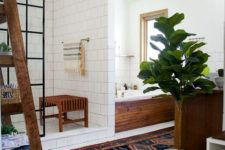 16 a boho chic space with white tiles, potted greenery, wooden touches and a boho rug