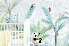 16 a fun tropical nursery with a creative watercolor tropical statement wall, colorful bedding and a panda toy