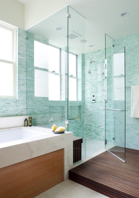 gorgeous turquoise little tiles in the lighter and bolder shades to create a watercolor feel in the bathroom
