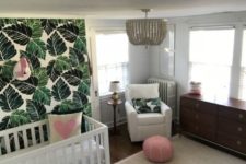 17 a cool nursery with a leaf print wall, pink touches and a flamingo head and a glam chandelier