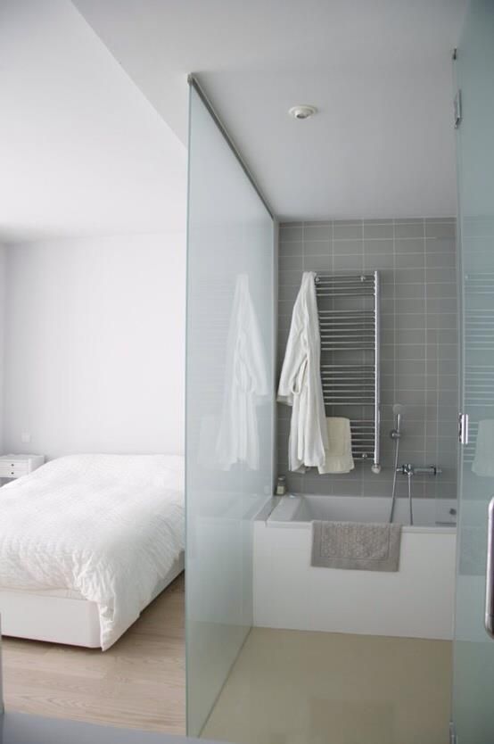 a frosted glass space divider is a great idea as it brings privacy yet doesn't separate too much