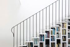 17 a white staircase that acts as a bookcase is all you need to save a lot of space in your home