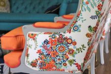 17 bold orange chairs with floral print backs look vintage and modenr at the same time