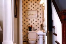17 vintage printed wallpaper and aartworks make the powder room connected to the living room