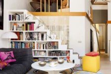 18 a white staircase with built-in bookshelves – the whole staircase functions as a bookcase