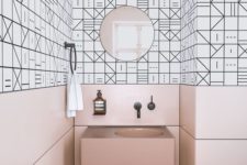 19 pink panels and a sink contrast the geometric black and white tiles and create a unique space