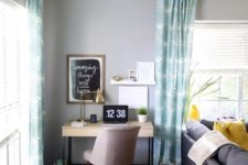 20 a chic home office nook that takes a corner behind the sofa and fits the room decor ideally