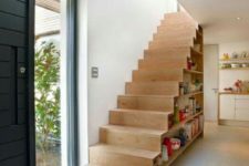 20 a wooden staircase with books inside is a creative and practical way to store them all