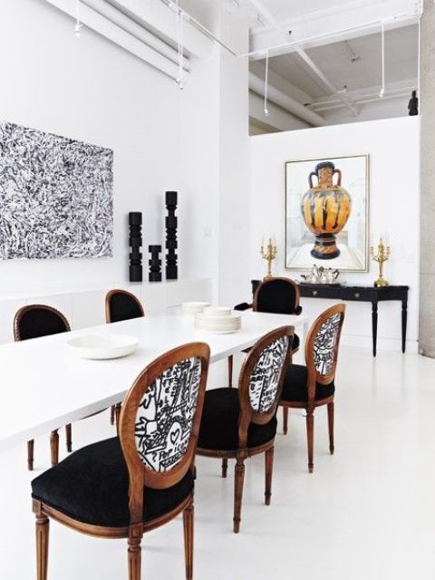 bold and cool chairs with black velvet seats and creative printed fabric on the backs to make a statement