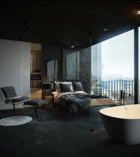 a sexy masculine bedroom with a glazed wall and a free-standing bathtub spearated with a glass divider