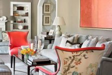 21 bold chairs with coral fronts and printed backs plus a coral artwork to match the look