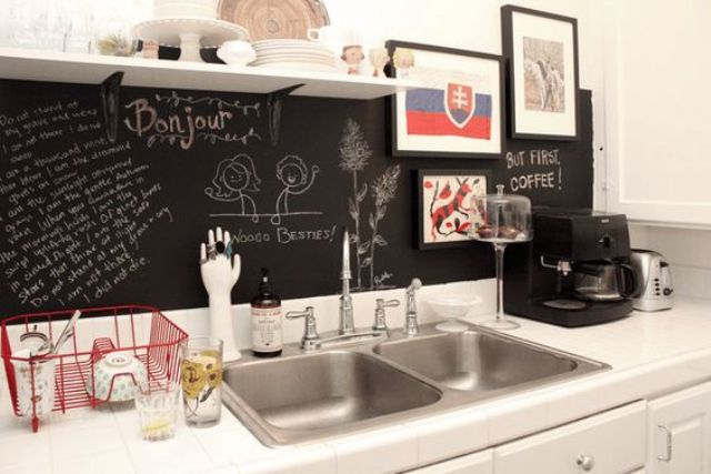 create a bold contrast with white cabinets and countertops and a chalkboard backsplash