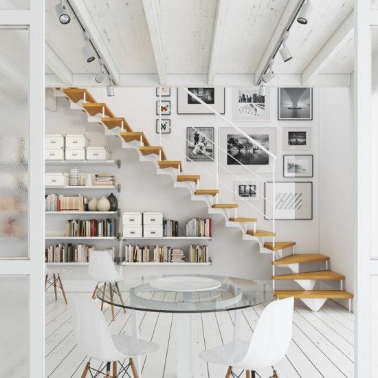 an airy whitewashed Scandinavian space with floating bookshelves under the stairs