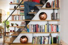23 bookshelves built in into the staircase itself – use the steps for sitting there