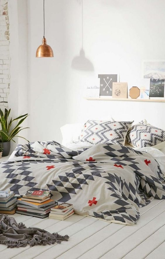 printed bedding in white, grey and red for a touch of print and color to the room