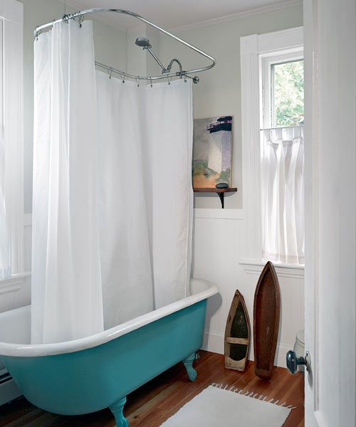 a vintage clawfoot bathtub painted turquoise is a great idea to add a chic and colorful touch to a neutral space