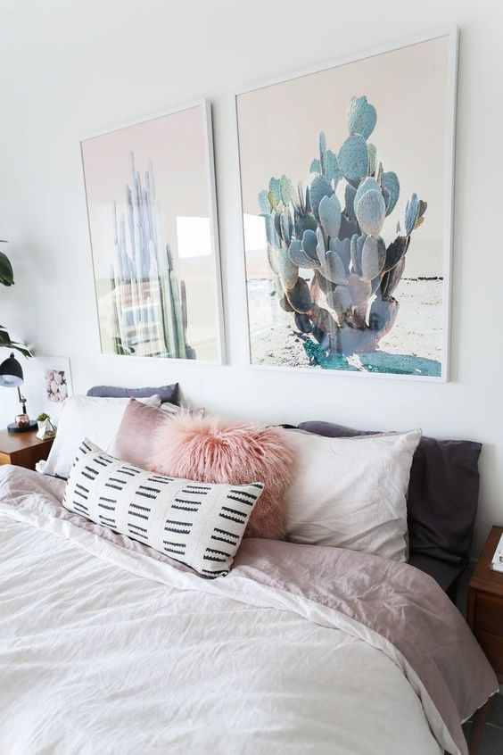 an amazing duo of cactus artworks is a chic way to bring a slight boho feel to the space