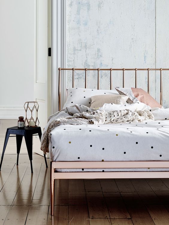 Spruce up the sleeping space with a touch of print like here   polka dots on the bedding