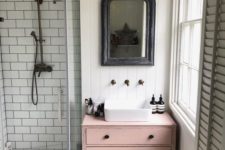 25 a dusty pink sink console table adds a touch of color and interest to the neutral bathroom
