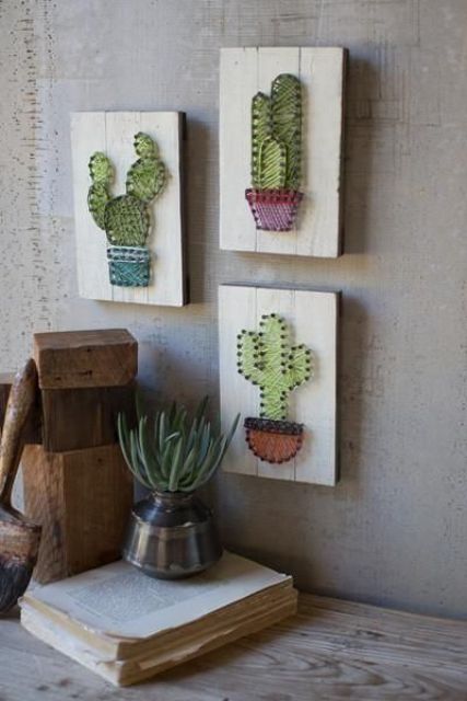 an arrangement of string artworks with cacti, string art pieces are extremely popular