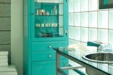 25 an old-fahsioned pharmacy cabinet redone with a bold color – turquoise, gets a new life and a fresh feel