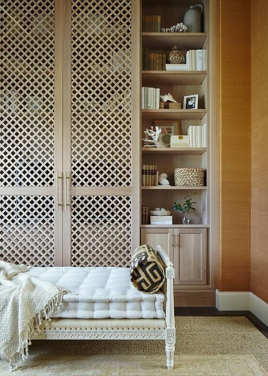 wood lattice sliding doors cover the shelves to avoid clutter and provide easy access to the stuff