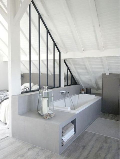 you may separate the bathtub zone with a stylish framed glass divider for more privacy