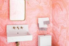 a lovely tiny powder room with watercolor walls