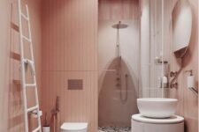a delicate blush bathroom with a bright terrazzo floor and white furniture and appliances to refresh the space