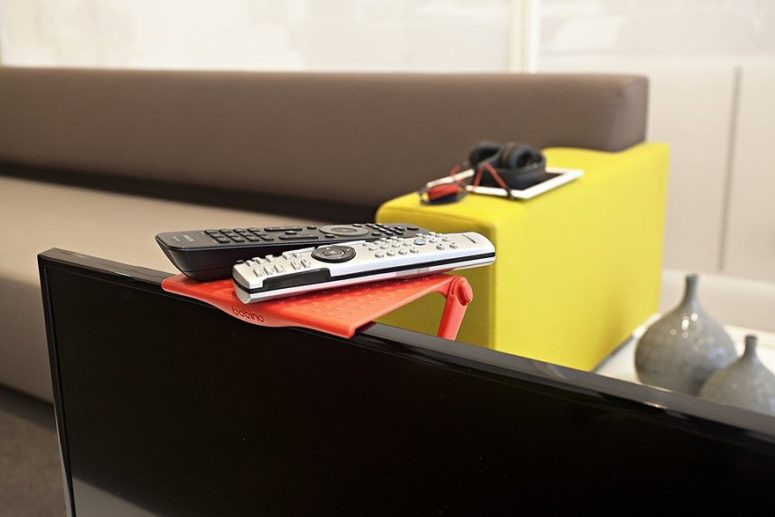 Bobino shelf uses dead space above your screen for storage of small items and accessories