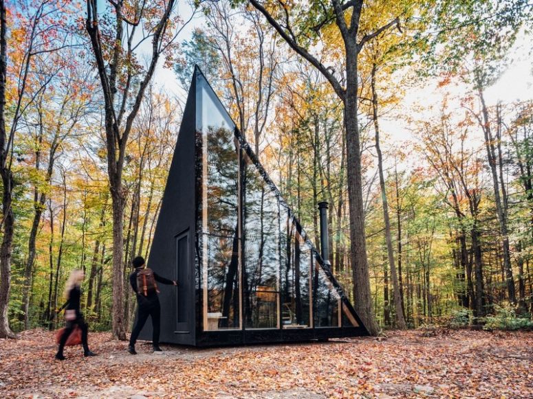 This tiny cabin in the woods features a unique crystal shape and is ideal for a weekend or a holiday